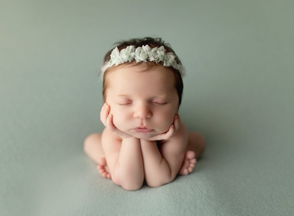 baltimore maryland newborn photography, infant girl in froggy pose with green headband